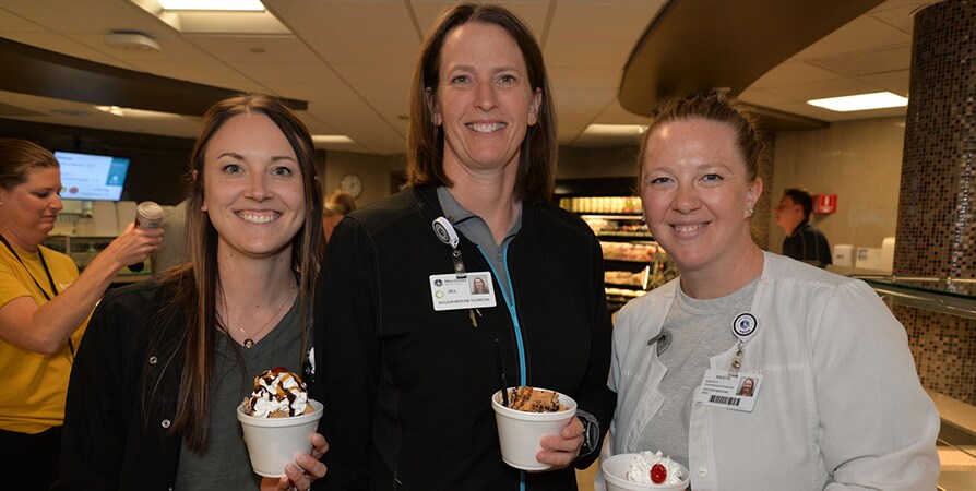 Employees enjoying a Sundae Bar.