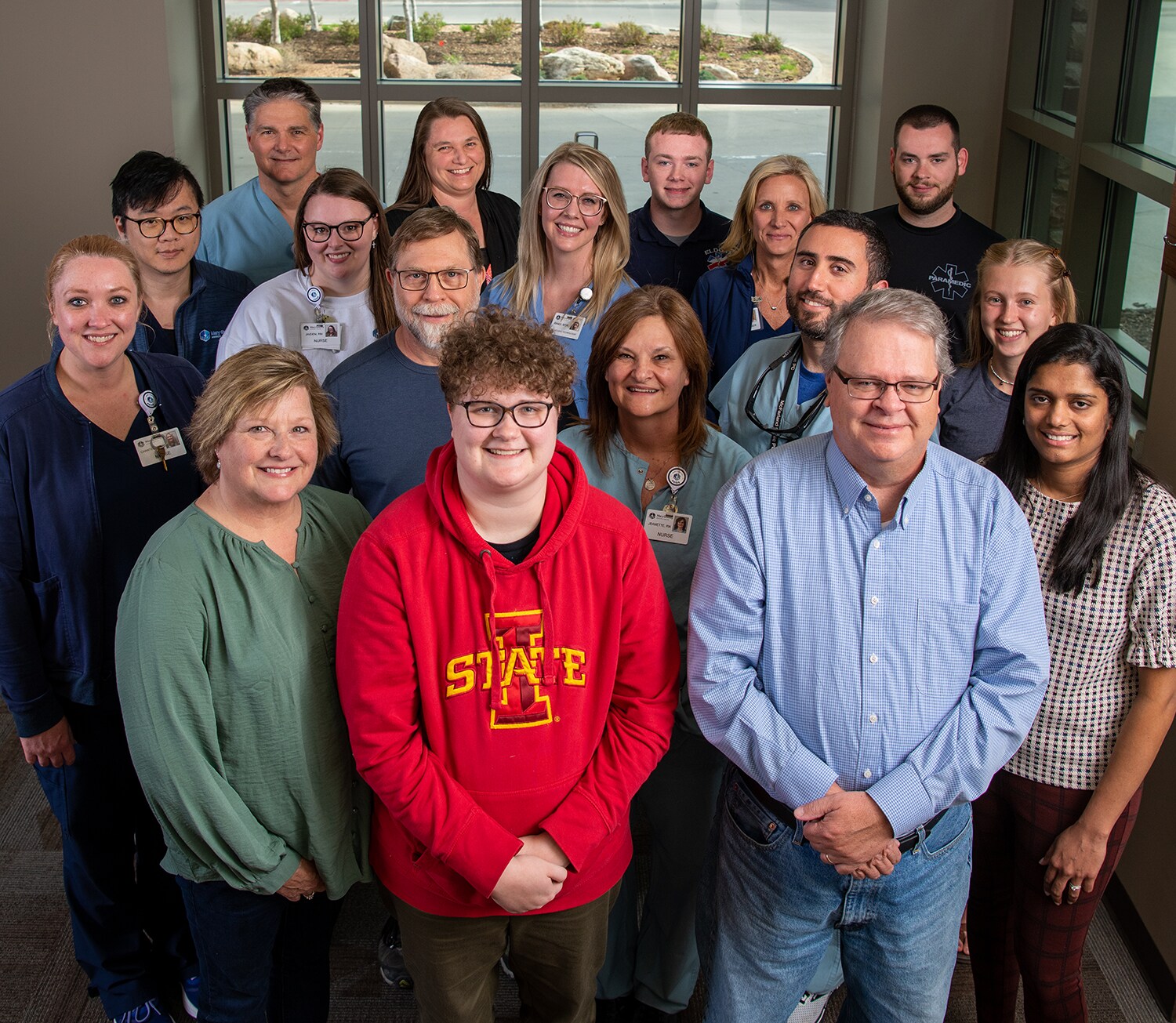 Payton Shaw, flanked by her parents, Amy and Terry, poses with some of the people who were part of her care team. 