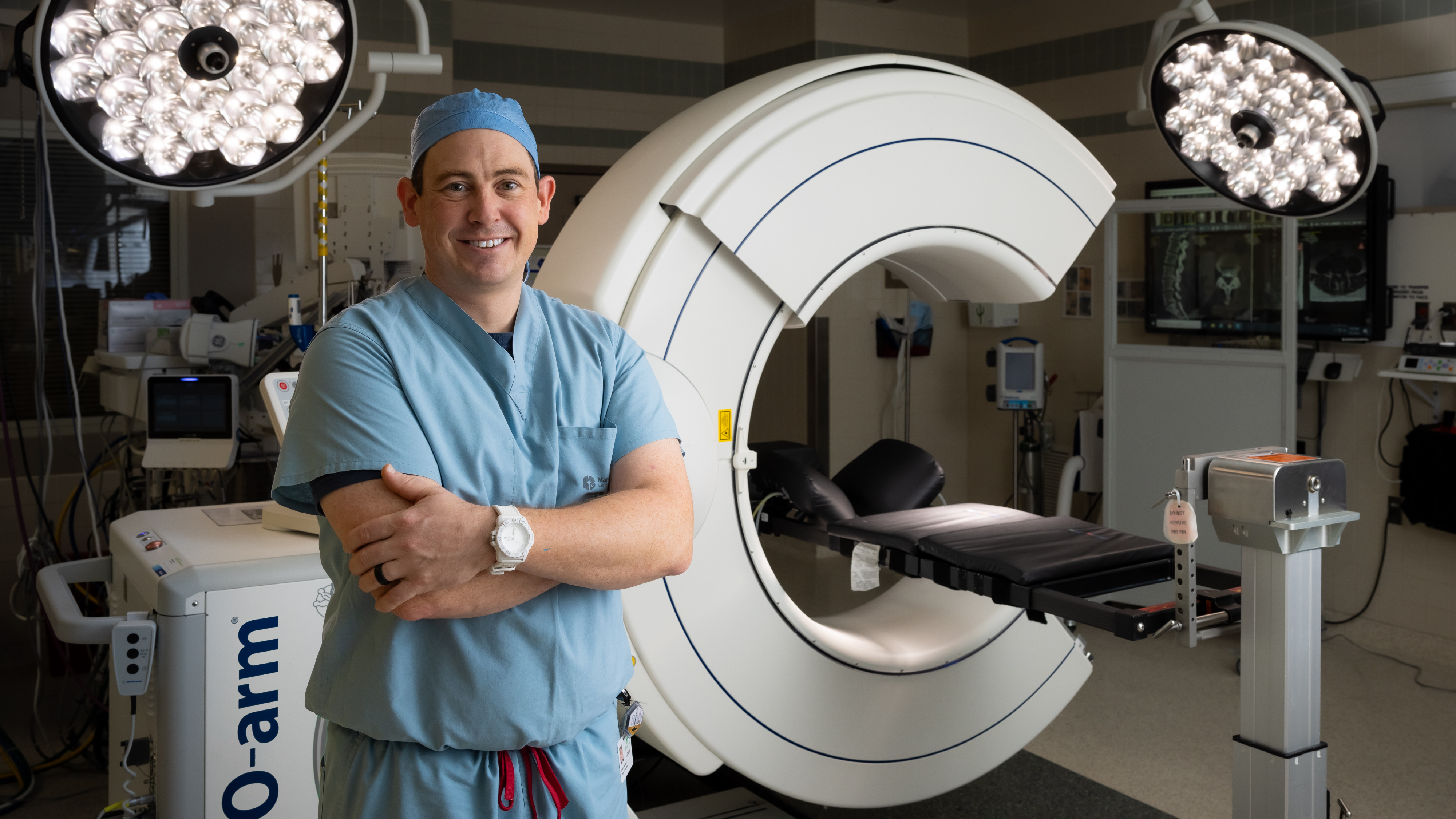 Dr. Jonathan Geisinger and the O-Arm, an advanced surgical tool he uses at Mary Greeley to assist in minimally invasive spine surgeries.