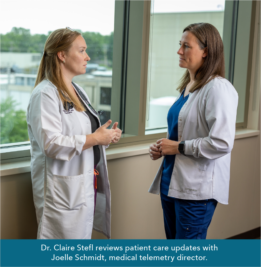 Dr. Claire Stefl reviews patient care updates with  Joelle Schmidt, medical telemetry director. 