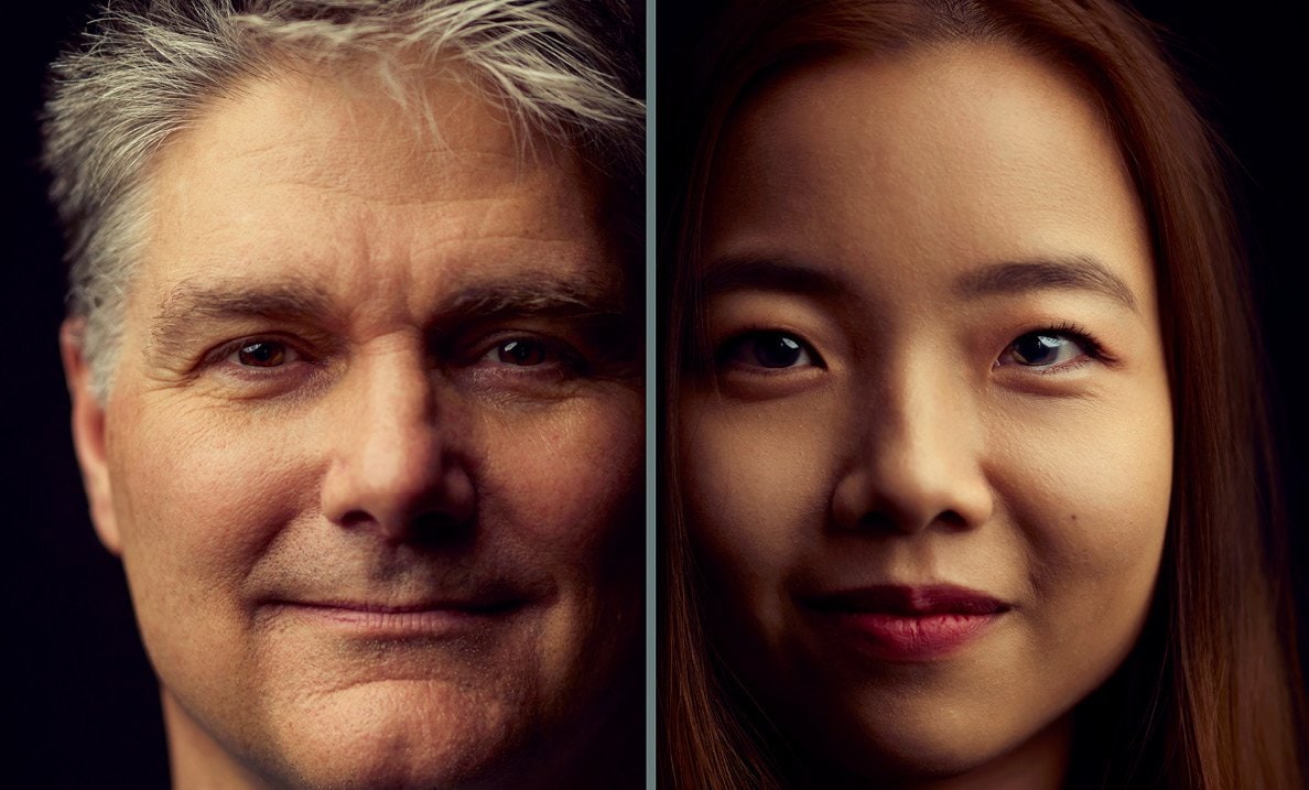 An older male and younger female close up headshot.