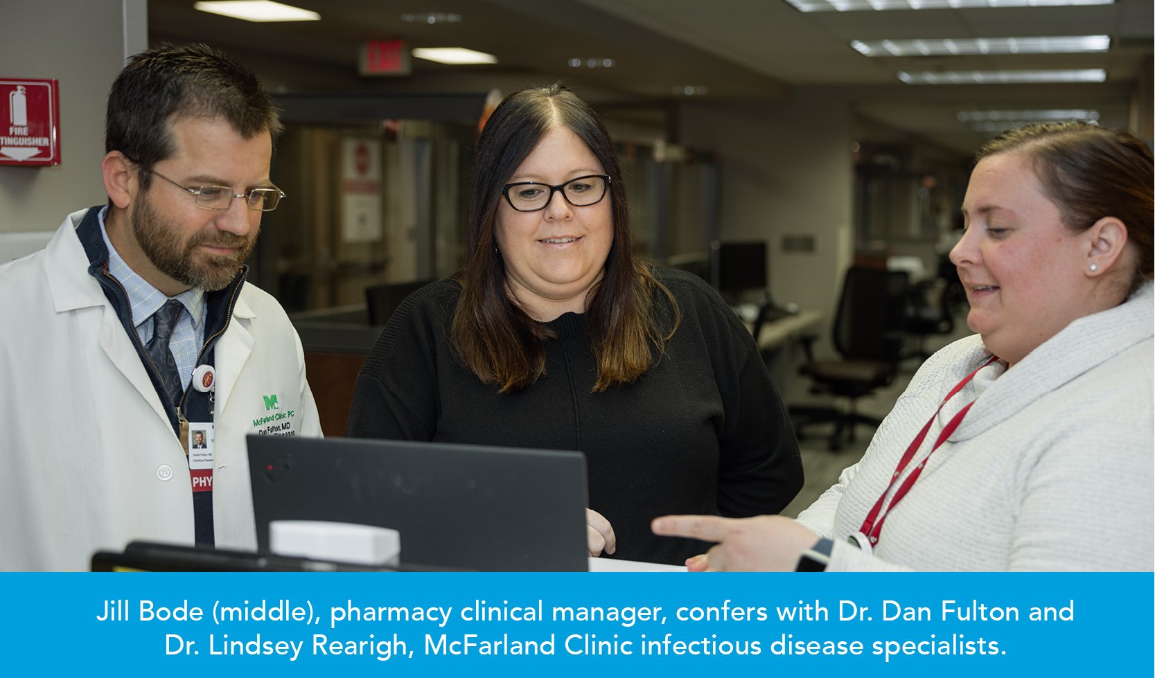 Jill Bode (middle), pharmacy clinical manager, confers with Dr. Dan Fulton and Dr. Lindsey Rearigh, McFarland Clinic infectious disease specialists.